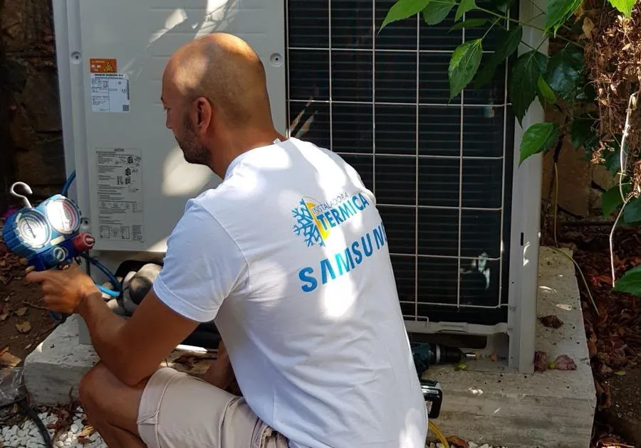 Technician working on an outdoor unit